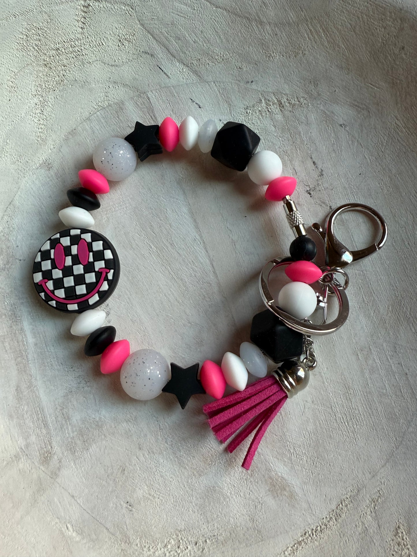 Retro Smiley Checkered Face Wristlet - Black/Pink
